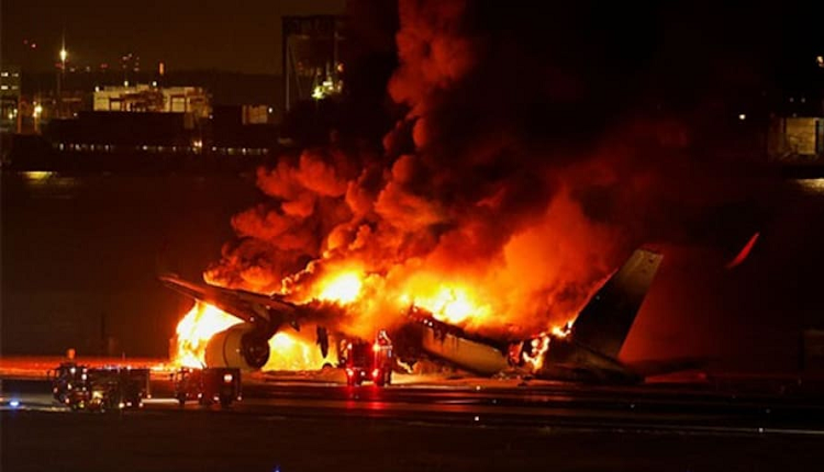 japan tokyo flight catches fire